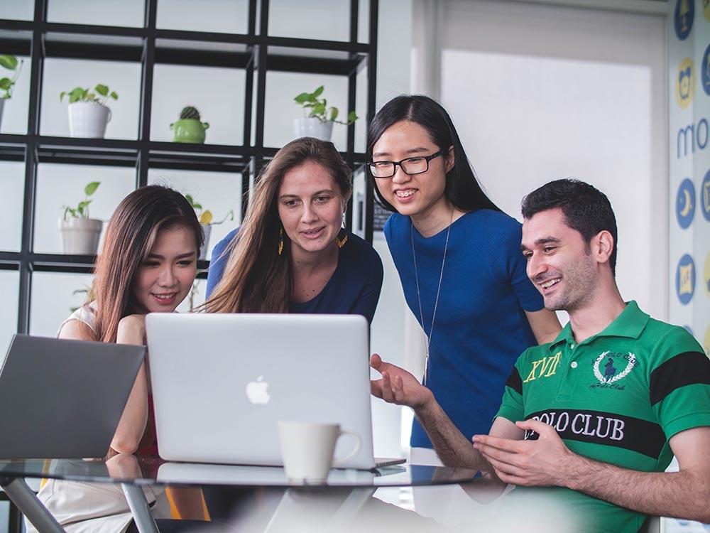 a group of people watching presentation